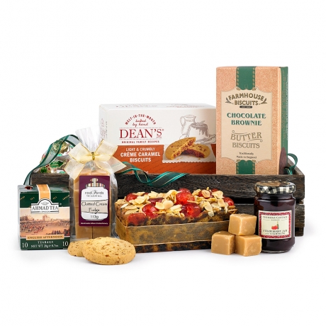 A deliciously thoughtful gift, this wooden slatted crate is filled with a selection of tempting bites which wouldn’t be out of place at an afternoon tea.<br /><br />
The English Afternoon Tea can be enjoyed whilst savouring a chunky slice of the Cherry & Almond Slab Cake and a biscuit or two.
<br /><br />This hamper contains <span class="bold">6</span> items;<br /><br />
<ul style="list-style:disc; margin-left:30px;">
<li>Original Cake Company Cherry & Almond Slab Cake 400g</li>
<li>Ahmad London English Afternoon Teabags</li>
<li>Farmhouse Luxury Chocolate Brownie Biscuits 150g</li>
<li>Radfords Clotted Cream West Country Fudge Bag 113g</li>
<li>Thursday Cottage Handmade Strawberry Jam 112g</li>
<li>Dean's Creme Caramel Biscuits 150g</li>
</ul>
<br />Delivered in a wooden slatted crate A deliciously thoughtful gift, this wooden slatted crate is filled with a selection of tempting bites which wouldn’t be out of place at an afternoon tea.<br /><br />
The English Afternoon Tea can be enjoyed whilst savouring a chunky slice of the Cherry & Almond Slab Cake and a biscuit or two.
<br /><br />This hamper contains <span class="bold">6</span> items;<br /><br />
<ul style="list-style:disc; margin-left:30px;">
<li>Original Cake Company Cherry & Almond Slab Cake 400g</li>
<li>Ahmad London English Afternoon Teabags</li>
<li>Farmhouse Luxury Chocolate Brownie Biscuits 150g</li>
<li>Radfords Clotted Cream West Country Fudge Bag 113g</li>
<li>Thursday Cottage Handmade Strawberry Jam 112g</li>
<li>Dean's Creme Caramel Biscuits 150g</li>
</ul>
<br />Delivered in a wooden slatted crate