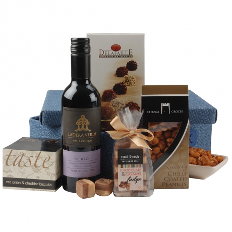 The perfect hamper to send to any man in your life, the contents are presented in a smart blue woven basket making it ideal to send to a special occasion, celebration or thank you.
<br /><br />This hamper contains <span class="bold">5</span> items;<br /><br />
<ul style="list-style:disc; margin-left:30px;">
<li>Ladera Verde Merlot 37.5cl - Chile</li>
<li>Eternal Grocer Chilli Coated Peanuts 100g</li>
<li>Radfords Chocolate & Caramel Fudge Bag 113g</li>
<li>Taste Savoury Red Onion & Cheddar Biscuits 50g</li>
<li>Delafaille Assorted Curlettes 100g</li>
</ul>
<br />Delivered in a blue foldable woven box with lid. (28x21x80cm) The perfect hamper to send to any man in your life, the contents are presented in a smart blue woven basket making it ideal to send to a special occasion, celebration or thank you.
<br /><br />This hamper contains <span class="bold">5</span> items;<br /><br />
<ul style="list-style:disc; margin-left:30px;">
<li>Ladera Verde Merlot 37.5cl - Chile</li>
<li>Eternal Grocer Chilli Coated Peanuts 100g</li>
<li>Radfords Chocolate & Caramel Fudge Bag 113g</li>
<li>Taste Savoury Red Onion & Cheddar Biscuits 50g</li>
<li>Delafaille Assorted Curlettes 100g</li>
</ul>
<br />Delivered in a blue foldable woven box with lid. (28x21x80cm)